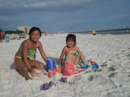 Kasen and Karis playing in the sand